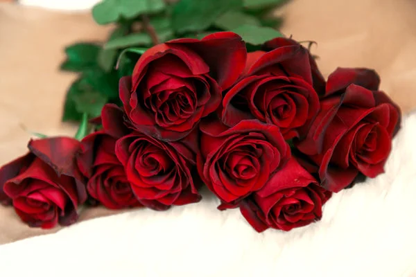 red rose bouquet on table